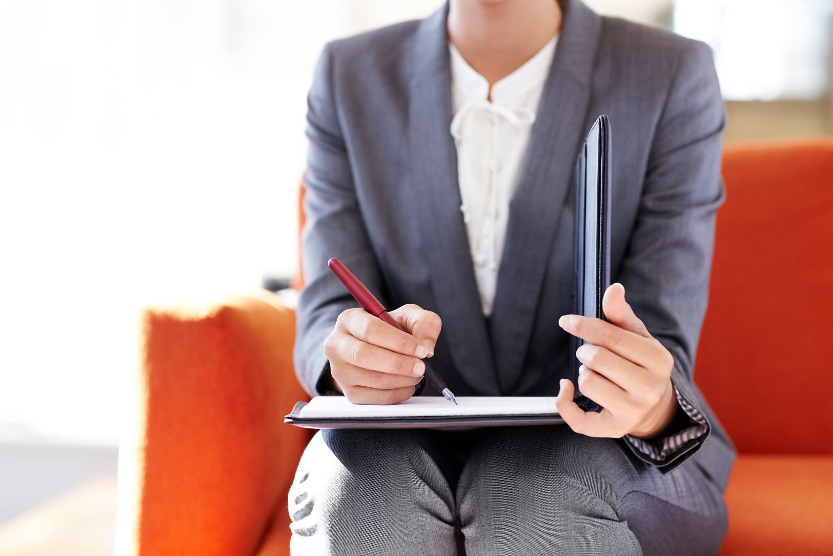 Female Corporate Executive Signing Document